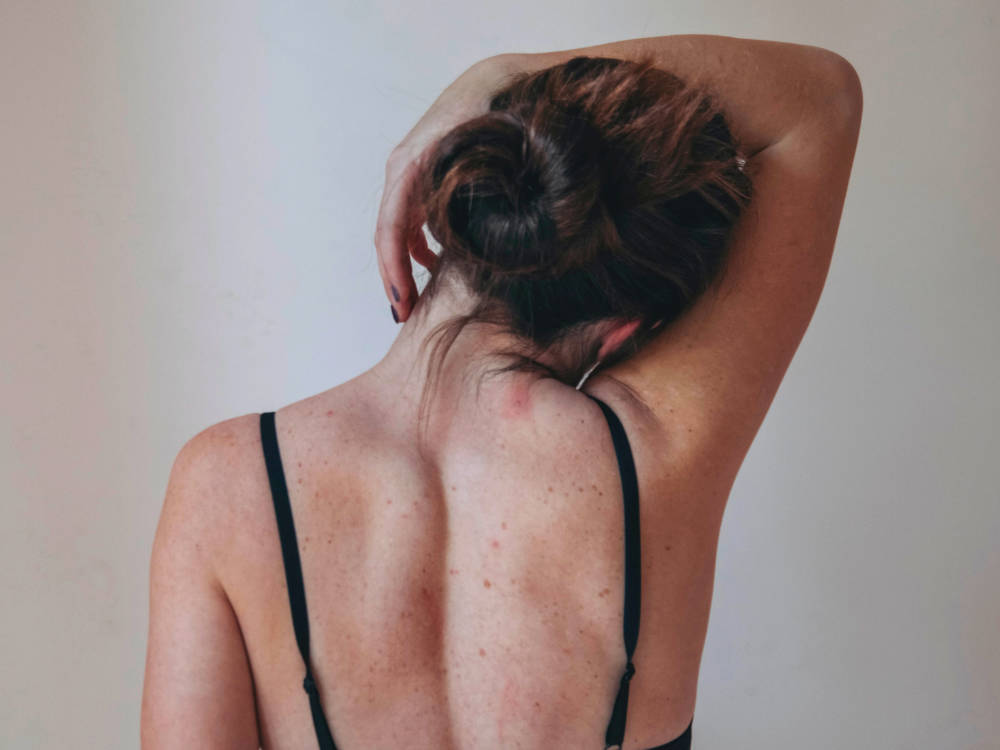 Get Back Pain Relief at Cherry Blossom Healing Arts Woman's back
